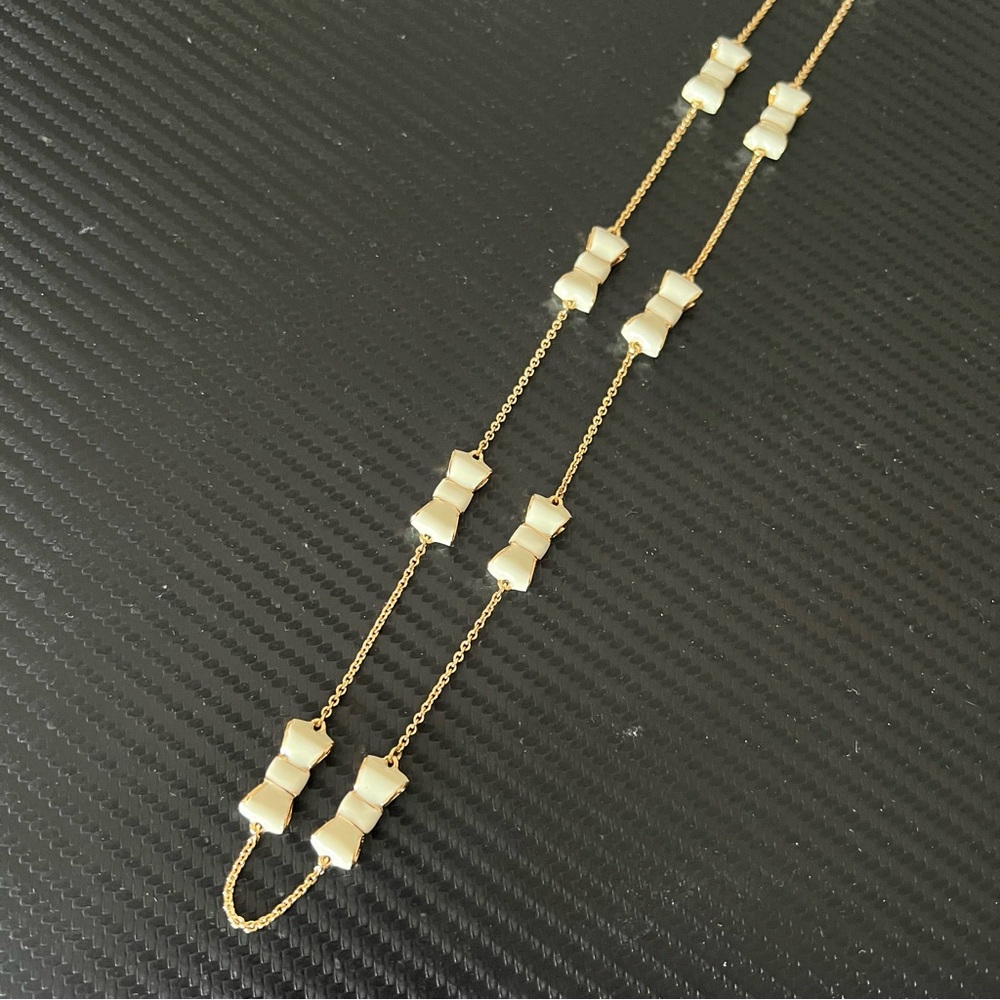Kate Spade Take a Bow Necklace Long Scatter Cream Enamel